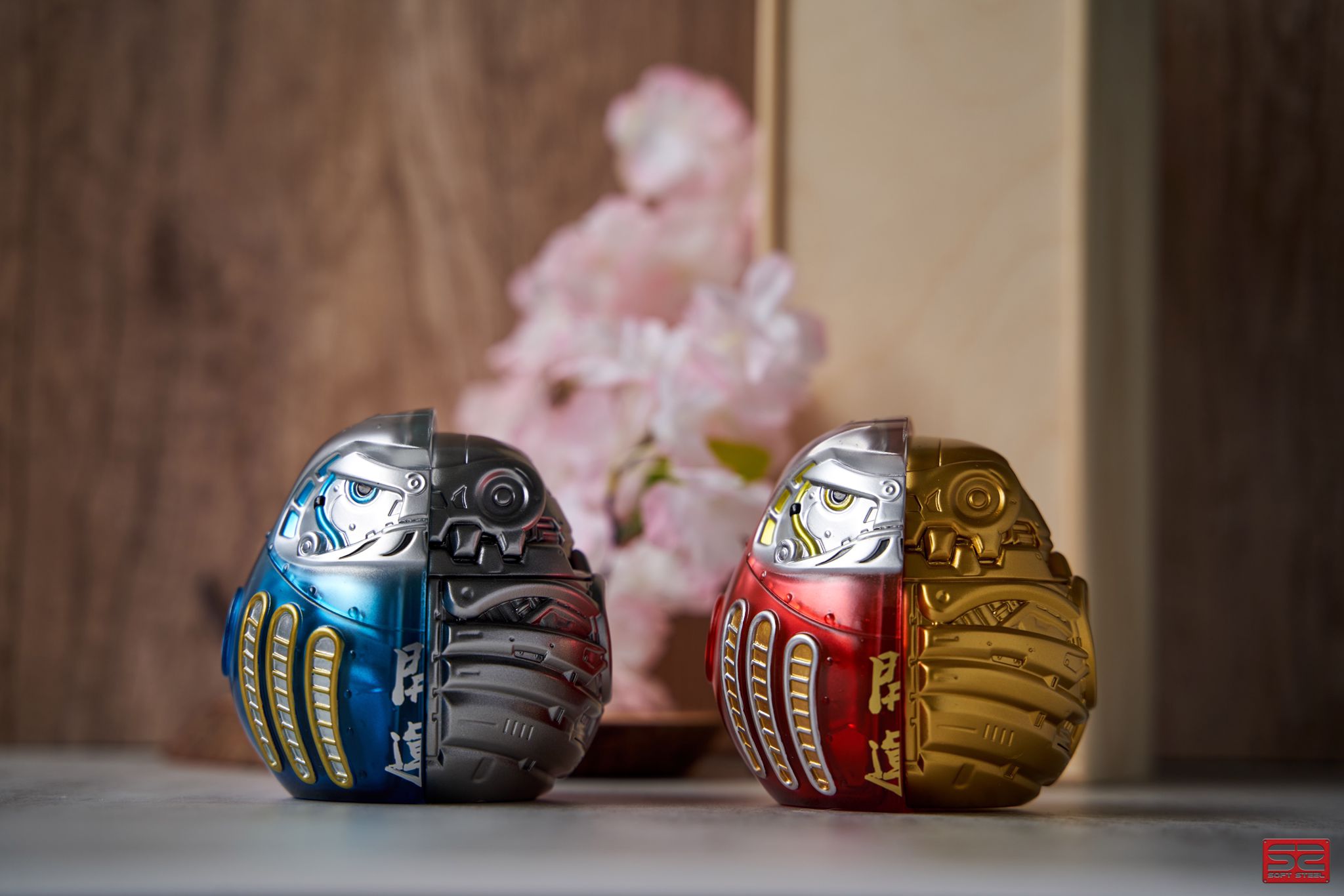 Soft vinyl Iron Daruma Aka / Aoi toy, around 10CM size, by Soft Steel. Two metal toys, blue and silver robot, close-up details.