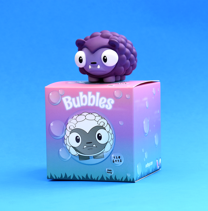 A cartoon toy bear with big eyes and a grumpy demeanor, companion to Luna from The Bots Bubbles Grape by The Bots & UVD Toys.