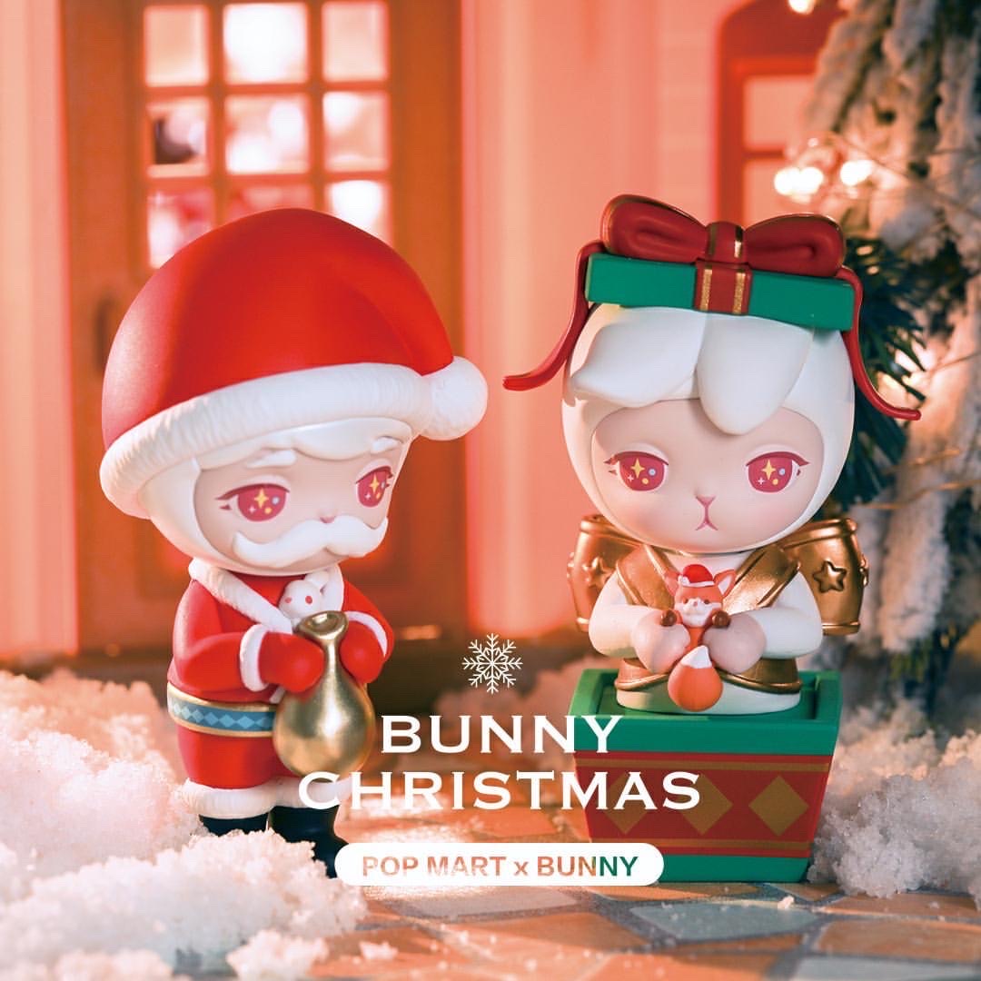 Bunny Christmas figurines in a box with Santa Claus, gifts, and more.