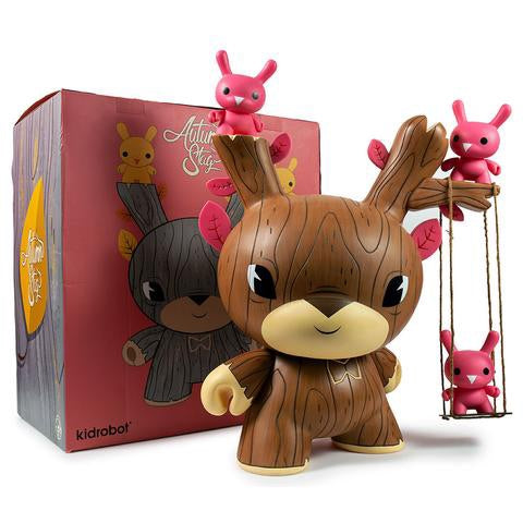 A close-up of a toy animal figure on a swing, part of the Autumn Stag 20 inch Dunny by Gary Ham x Kidrobot collection.