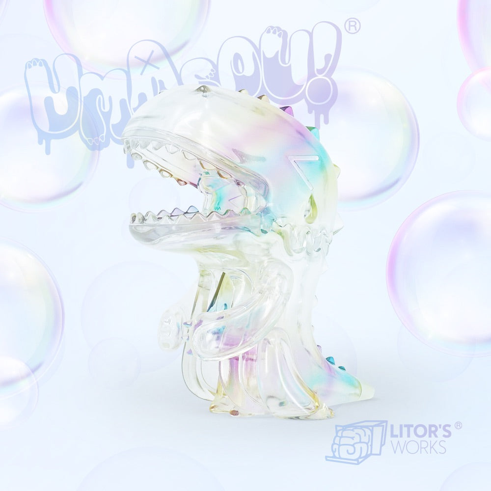 Umasou Bubble toy with transparent design and bubble details, featuring a plastic dinosaur and spikes.