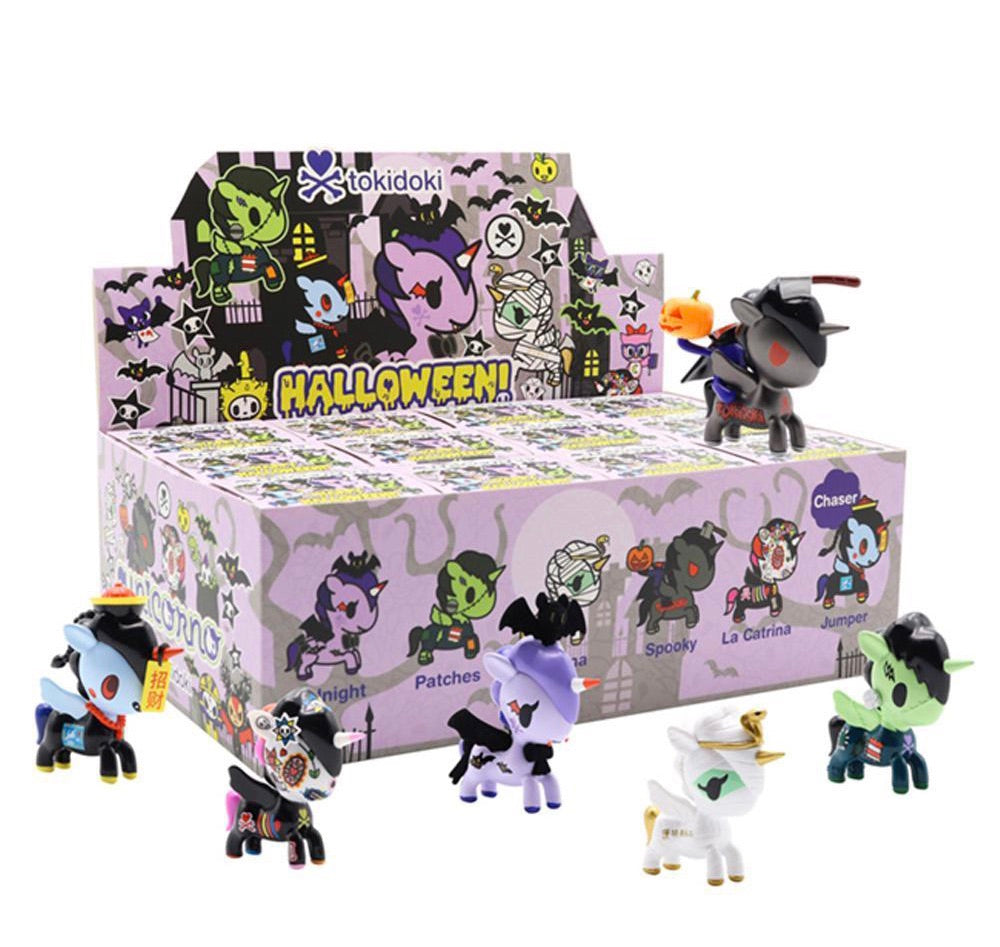 Halloween Unicorno Blind Box with toy animals and variety of toys, including La Catrina, Patches, Neferina, Jumper, Spooky, and Midnight.