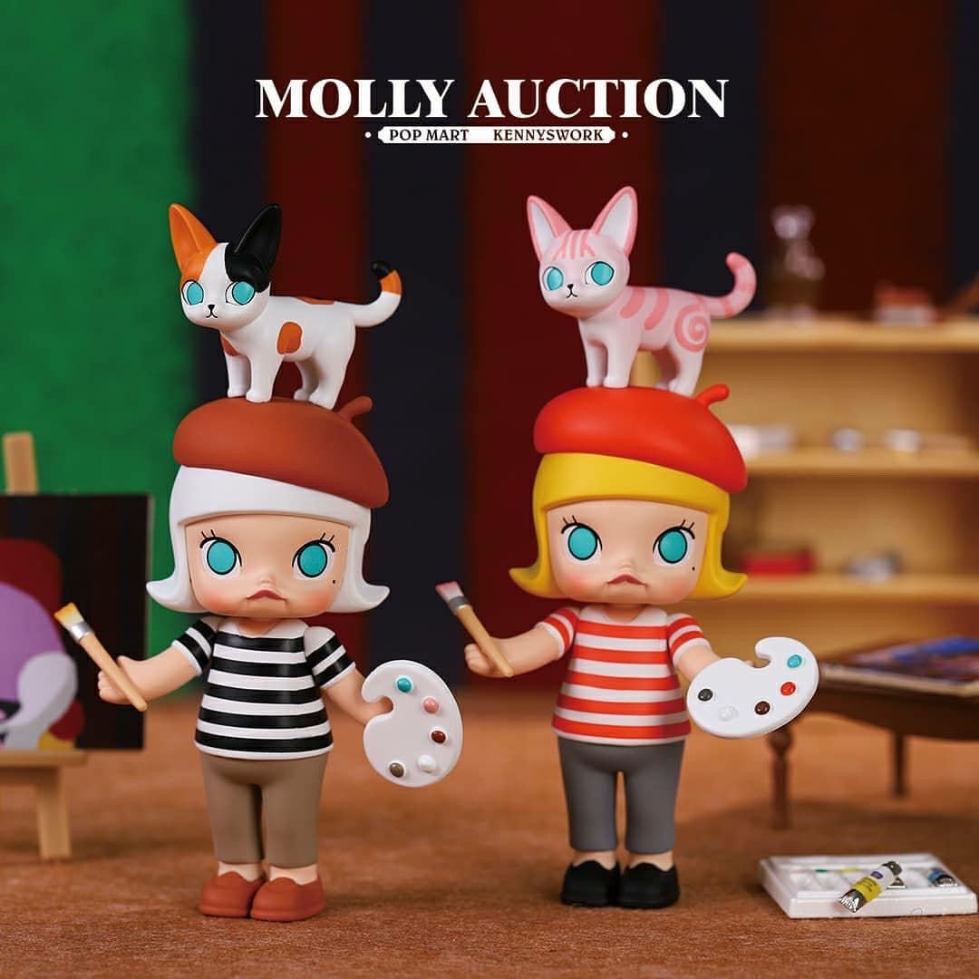 Molly Auction Series by Kennyswork: Toy cat figurines with a tube of paint and a doll.