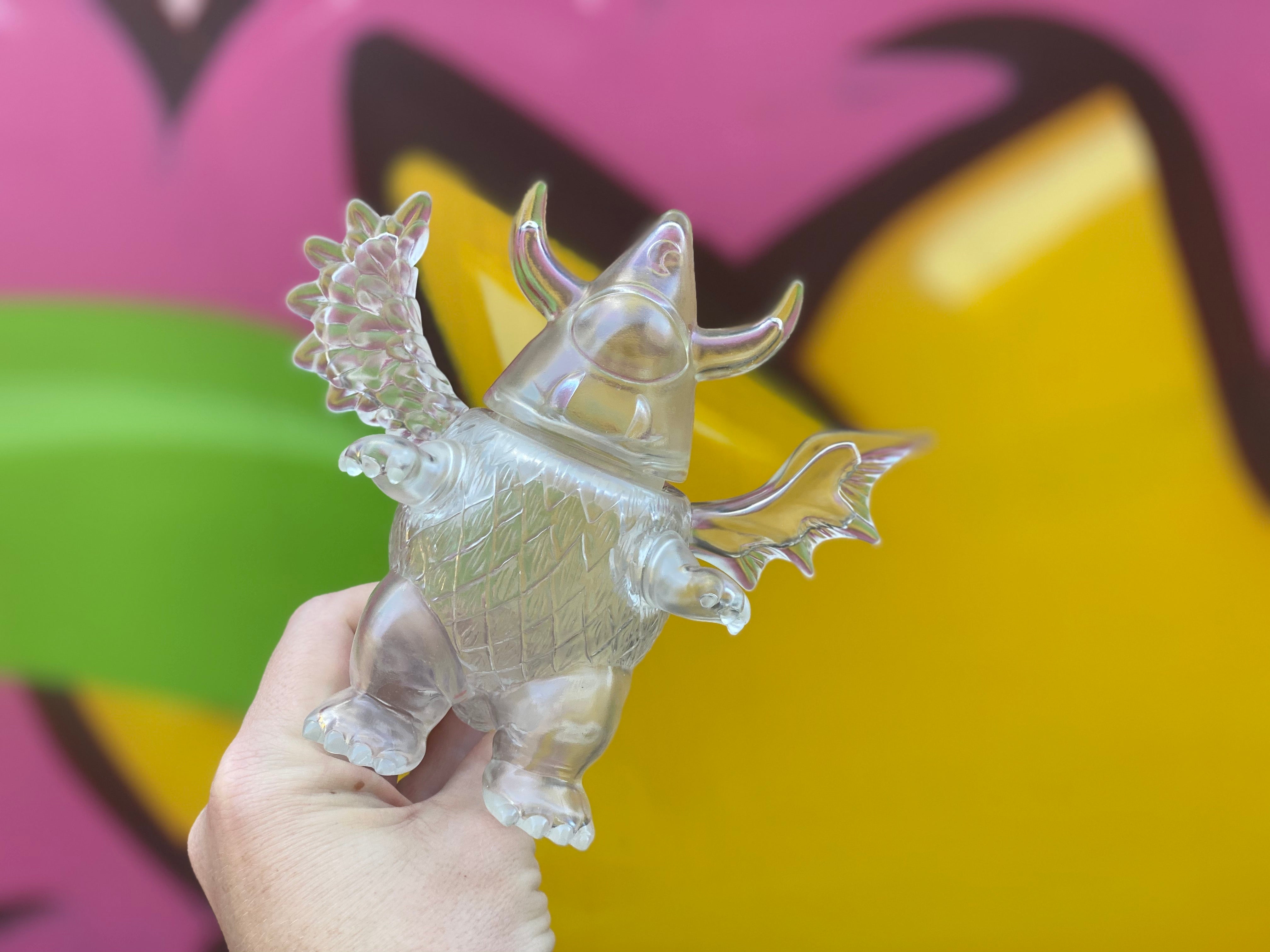 Sofubi toy Hoshirudon Clear by Sky Toy, a hand holding a clear plastic toy with wings, 14cm spinning head.