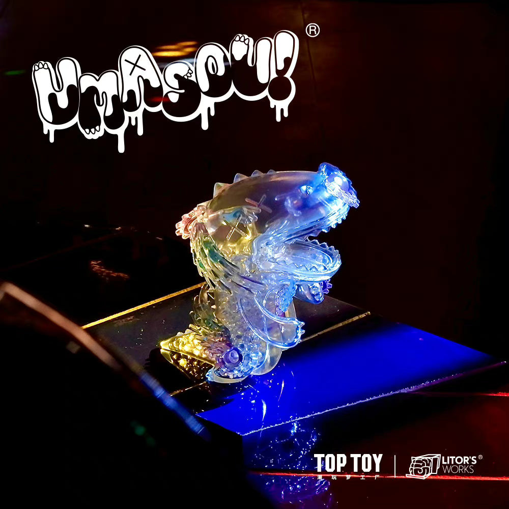 A limited edition Umasou! The World resin toy with a plastic animal and light, glass statue, and text.