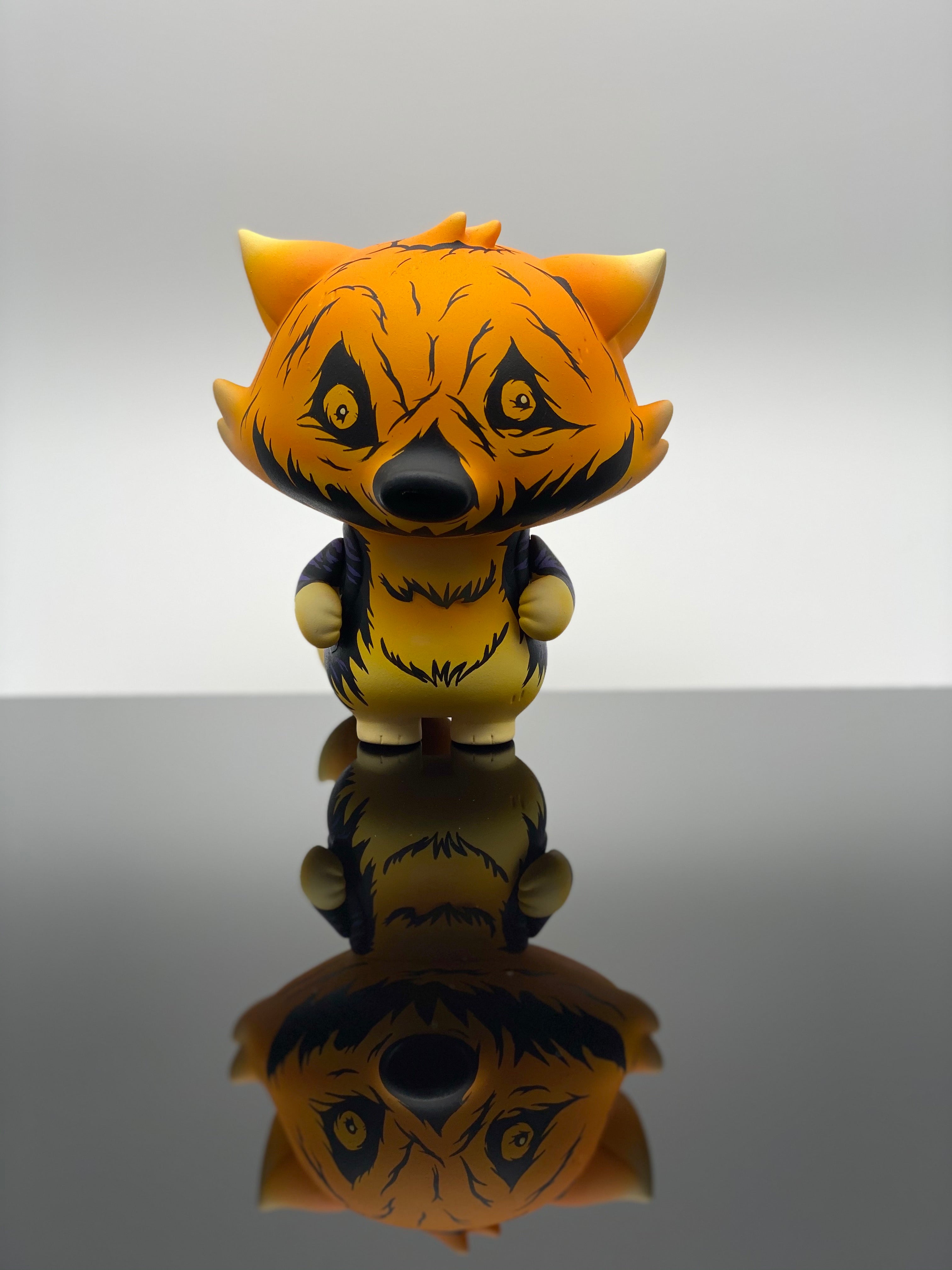 A custom Goobi Fox vinyl toy figurine on a reflective surface.