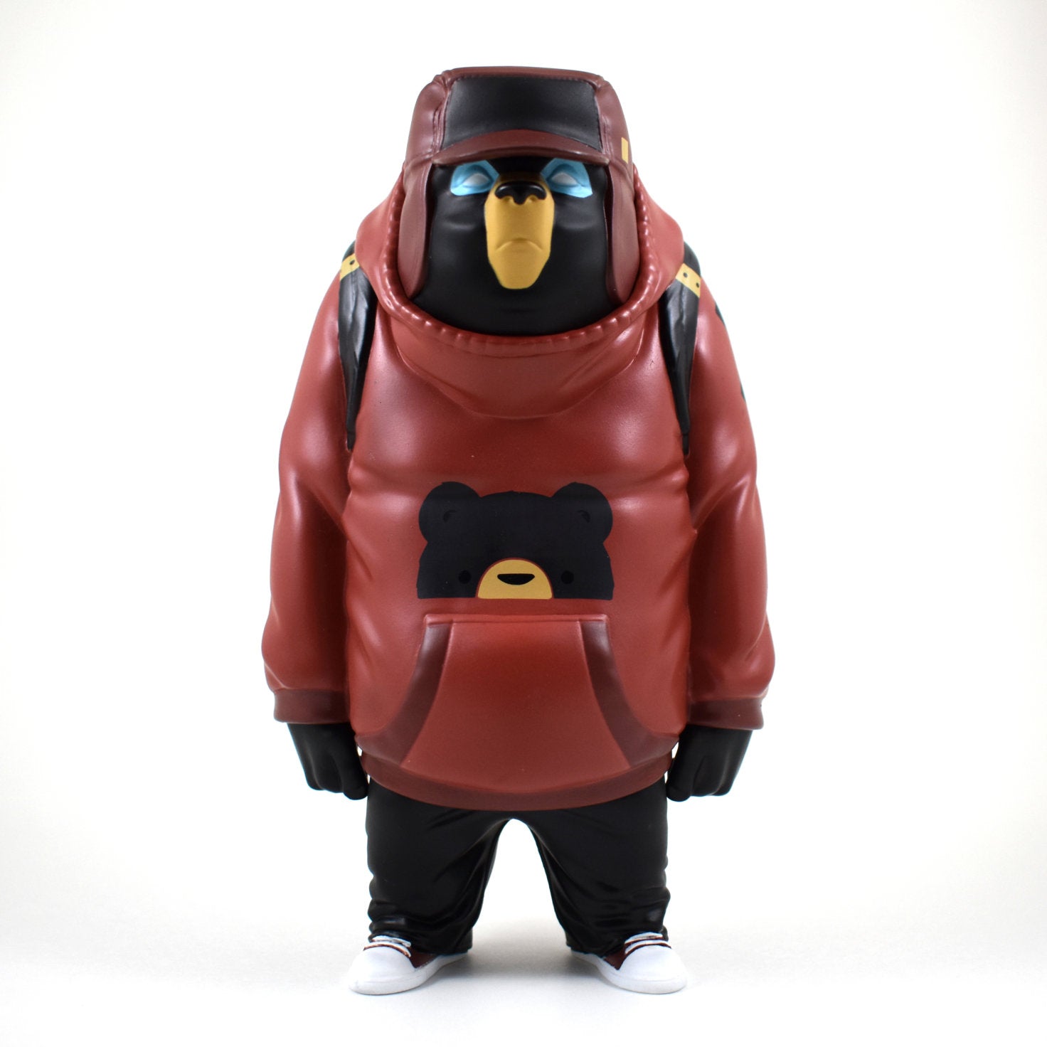A toy bear in a red jacket, part of the Kub Brick Red Colorway by Mike Fudge vinyl figure collection.