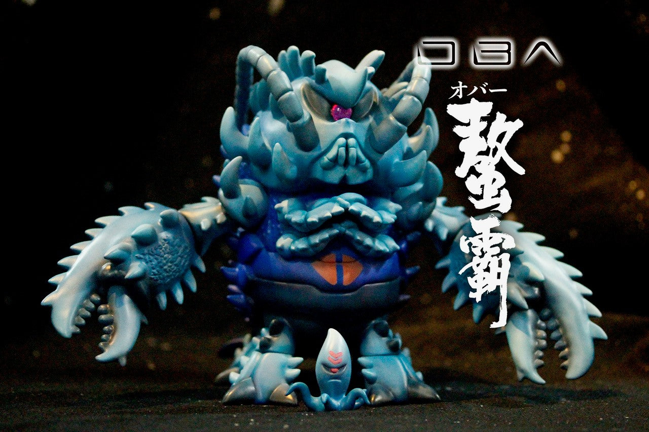 Toy figure with sharp teeth and face, close-up of dragon's claw. OBA - Blue by OBAZONE.