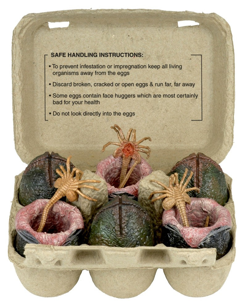 Alien Xenomorph Egg Set in Collectible Carton with fake bugs and aliens, dinosaur head, plant, alien, toy alien, and alien creatures.