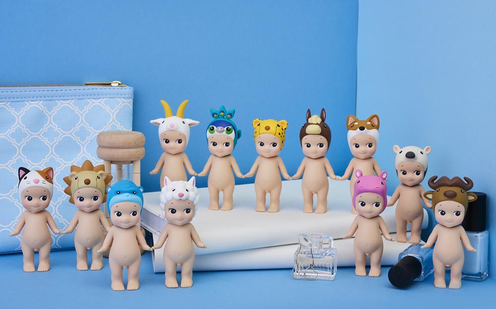 Sonny Angel - Animal series Ver.4: A group of small dolls and toys from a blind box set, featuring various figures including teddy bears and dolls.