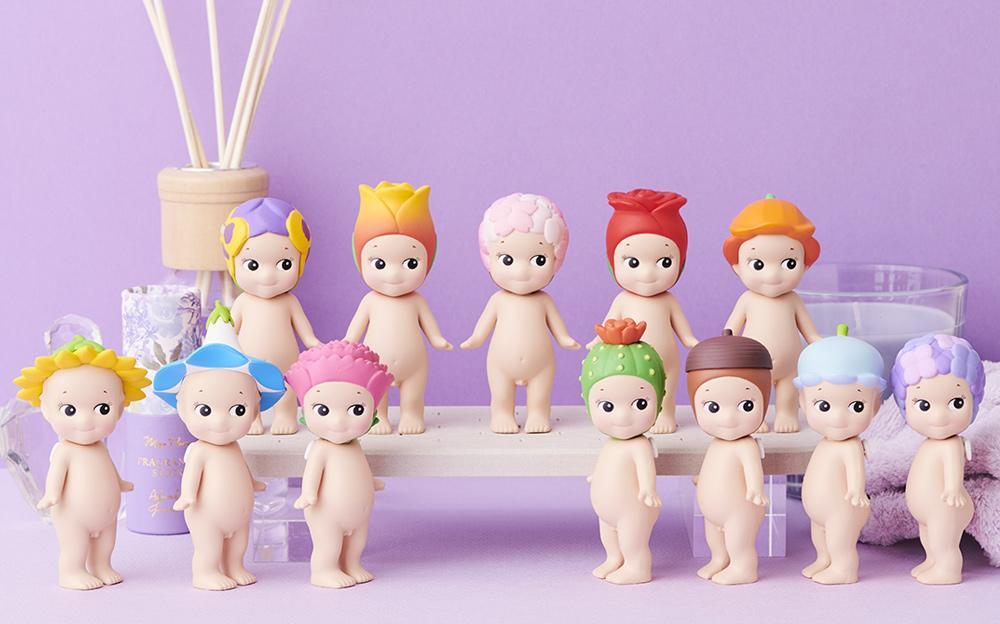 A group of small dolls from the Sonny Angel - Flower series blind box collection.